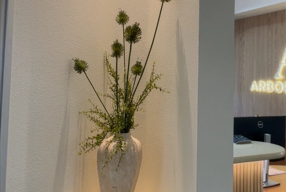 Dental clinic interior with decorative flowers and a welcoming patient-friendly atmosphere
